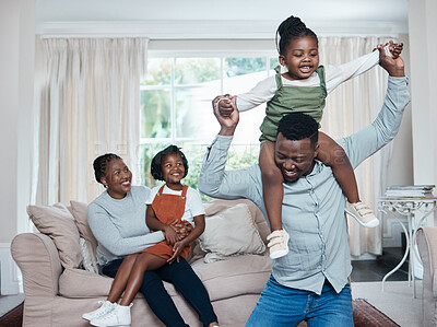 Buy stock photo Shot of a happy family having fun while relaxing together at home
