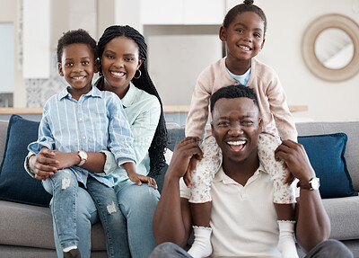 Buy stock photo Cropped portrait of an affectionate young family of four relaxing in the living room at home