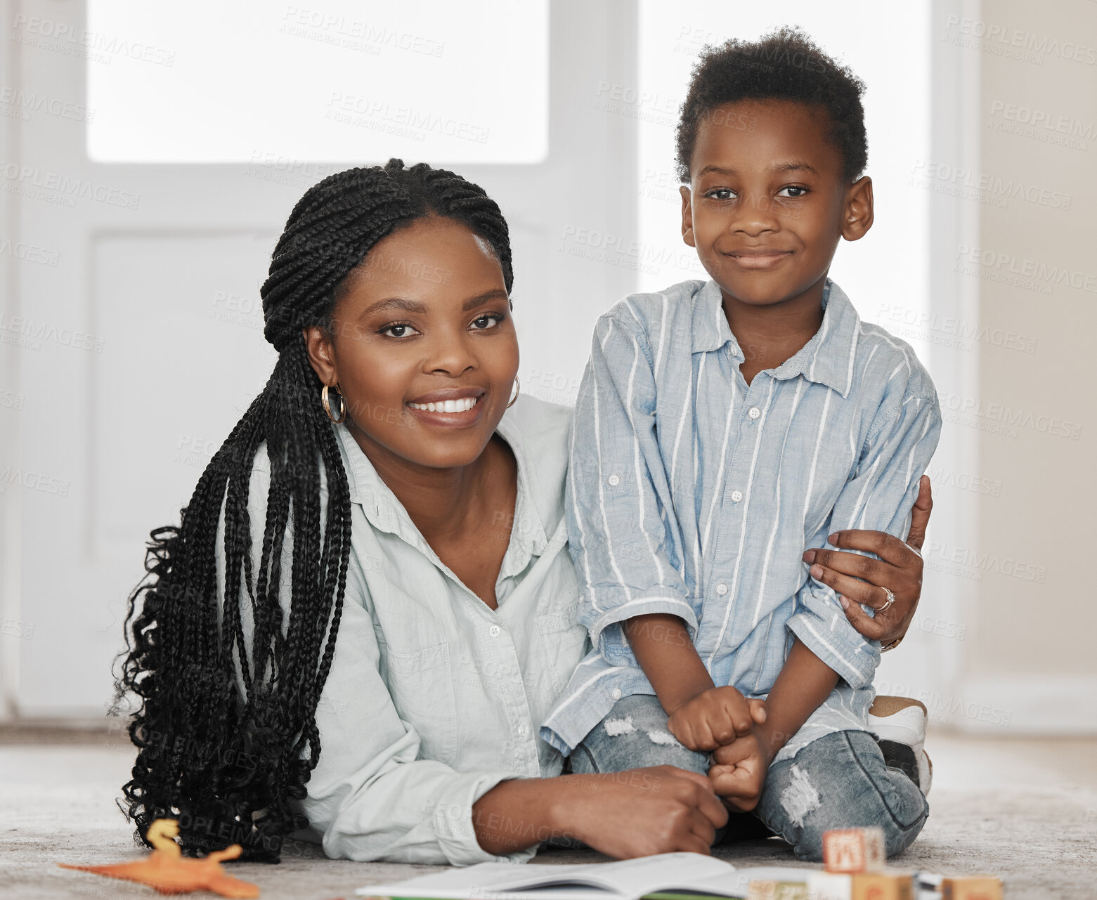 Buy stock photo Black family, portrait or mom and son with toys in home together for education, learning and development. Happy, woman and boy child embrace on floor for love, affection and playing on weekend