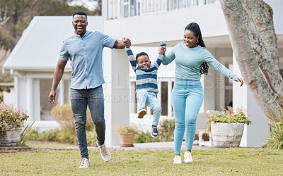 Buy stock photo Happy parents lifting their kid by their new home in the outdoor garden while playing together. Backyard, bonding and African mother and father holding their boy child in the backyard of their house.