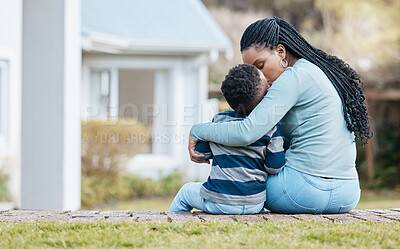 Buy stock photo Shot of a young mother sitting and bonding with her son in the garden