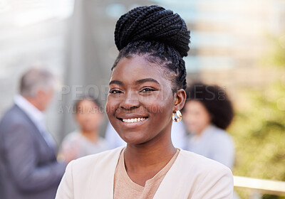 Buy stock photo Shot of an attractive young businesswoman standing outside while her colleagues discuss behind her