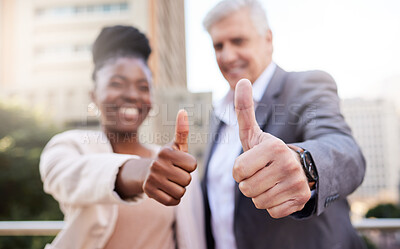 Buy stock photo Shot of two businesspeople standing outside on the balcony together and showing a thumbs up