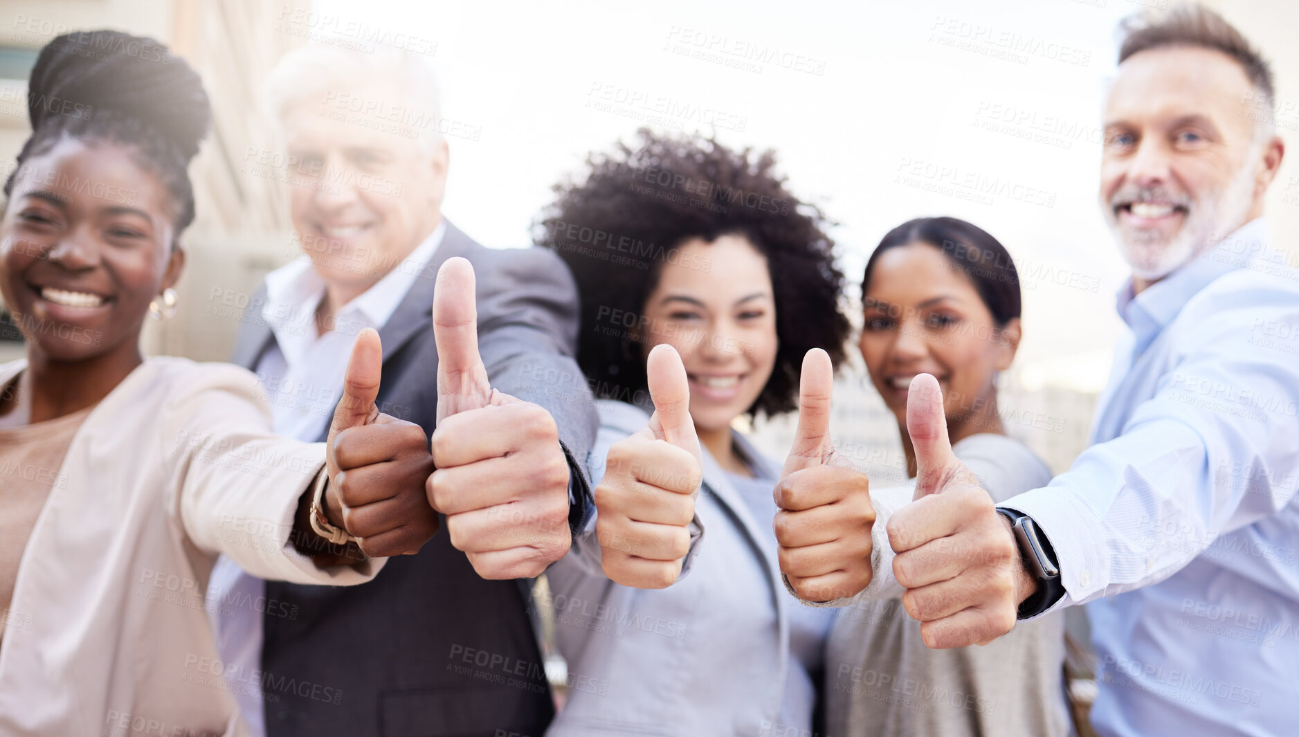 Buy stock photo Shot of a diverse group of businesspeople standing outside on the balcony together and showing a thumbs up