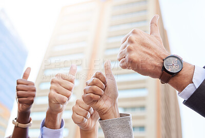 Buy stock photo Cropped shot of an unrecognisable group of businesspeople standing together outside and showing a thumbs up