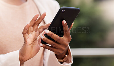 Buy stock photo Cropped shot of an unrecognisable businesswoman standing alone on the balcony outside and using her cellphone