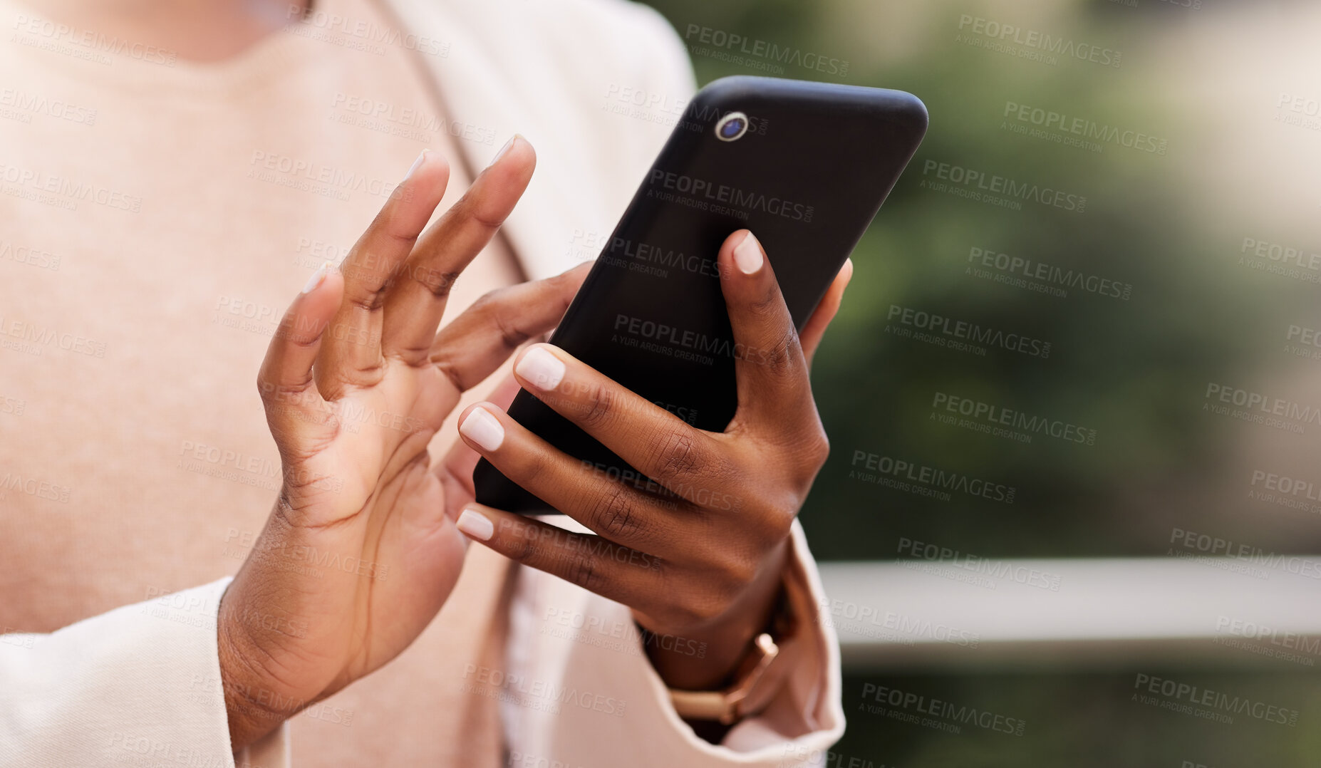 Buy stock photo Cropped shot of an unrecognisable businesswoman standing alone on the balcony outside and using her cellphone