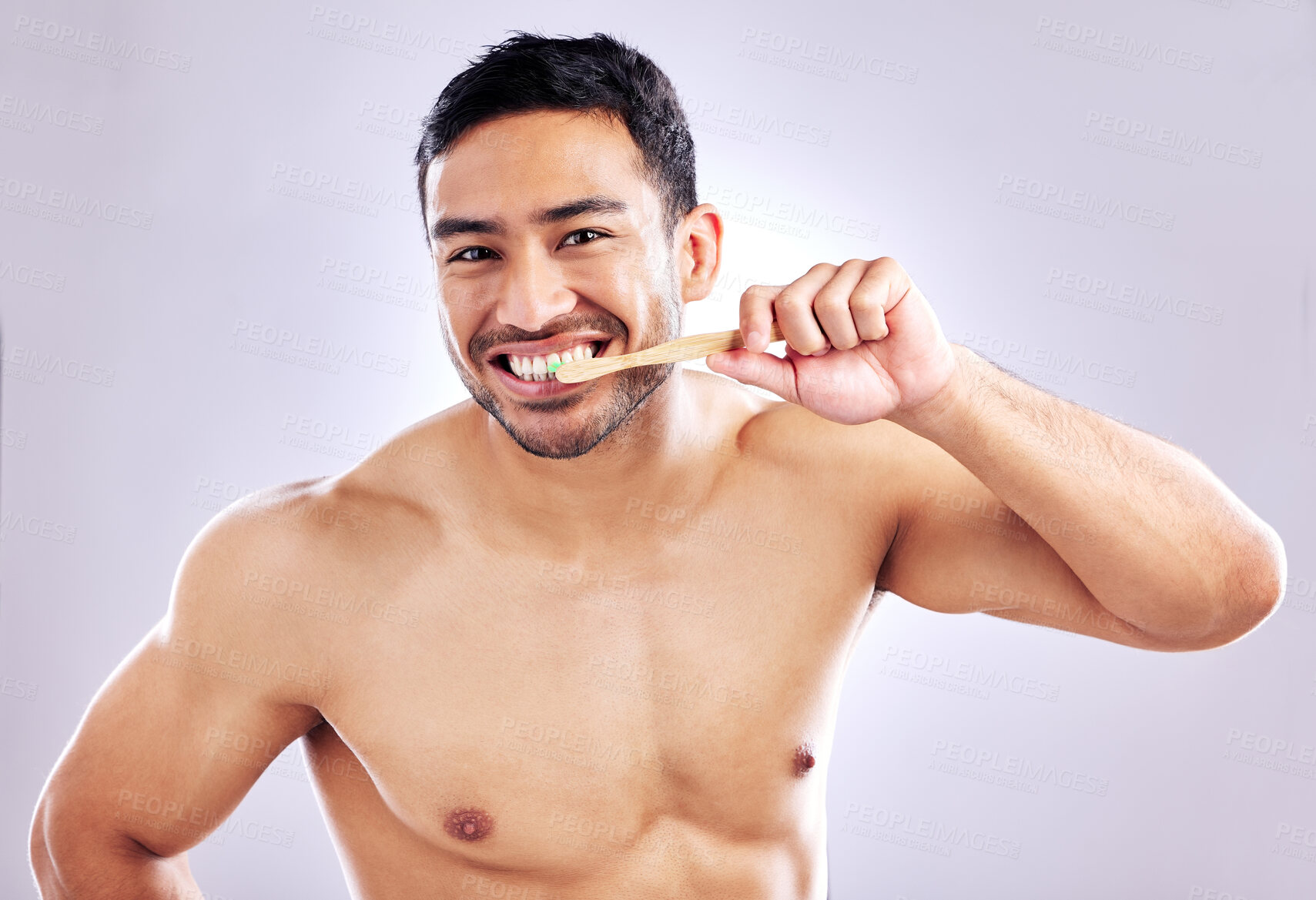 Buy stock photo Hygiene, portrait and man with bamboo brush for teeth, sustainability and biodegradable of product. Studio, white background and cleaning of tooth for person, grooming and oral health with wood