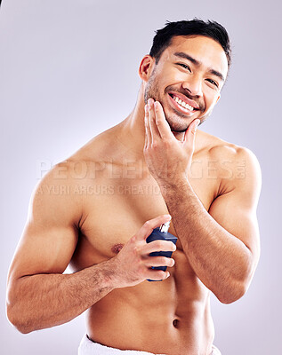 Buy stock photo Man, smile and aftershave for face, beard and grooming for beauty and aesthetic wellness for healthy skin on studio background. Happy, guy and model for facial hair or dermatology, body and cosmetics