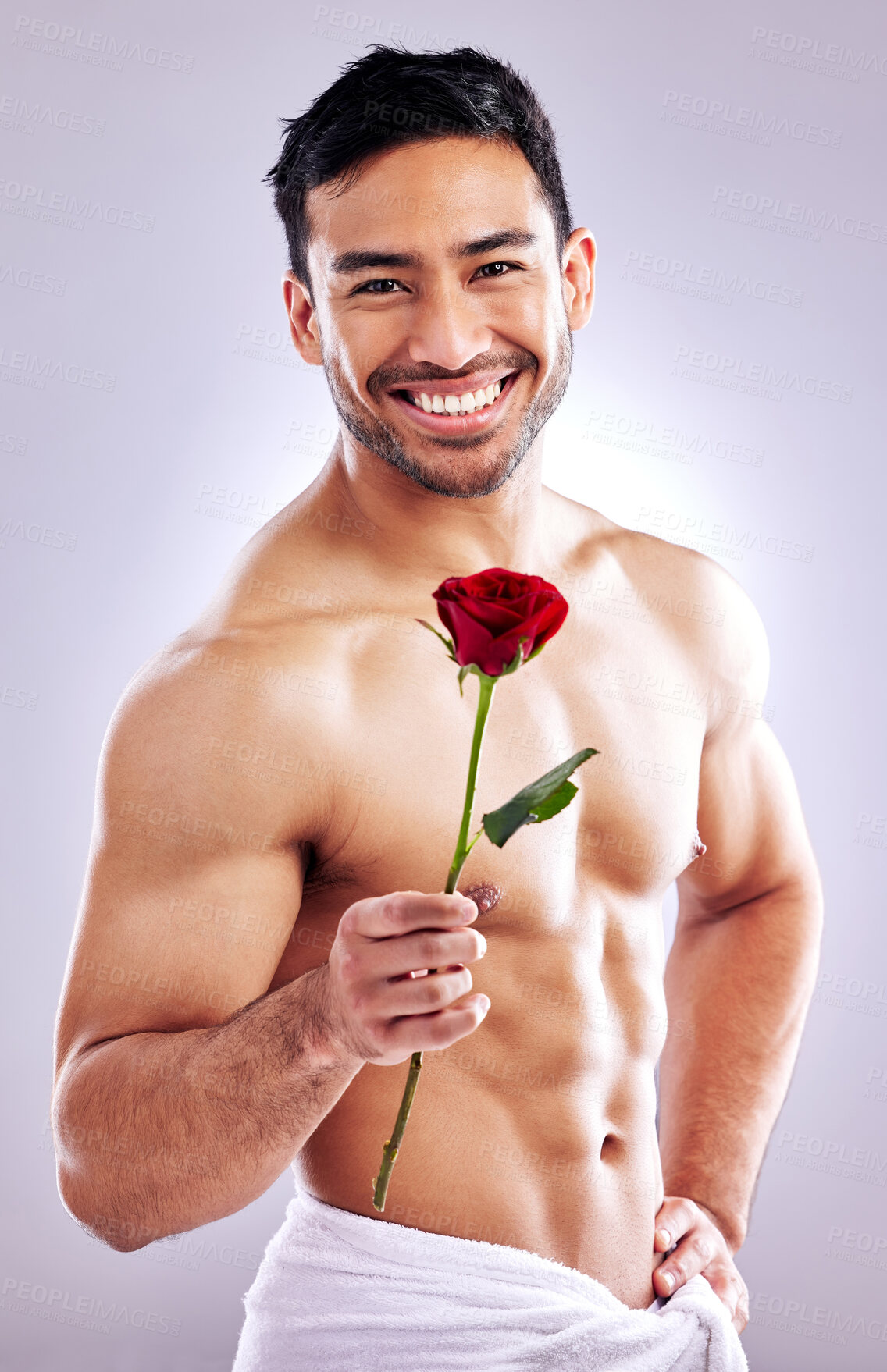 Buy stock photo Man, rose and shirtless body in studio for natural scent, luxury fragrance or cosmetics. Spanish model, flower and beauty on white background with mockup space for organic aroma or designer cologne