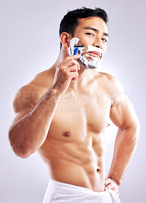 Buy stock photo Body, razor and portrait of man shaving face for skincare, health and hair removal for hygiene isolated on white studio background. Cream, beard and trim for cleaning, beauty and muscle for grooming