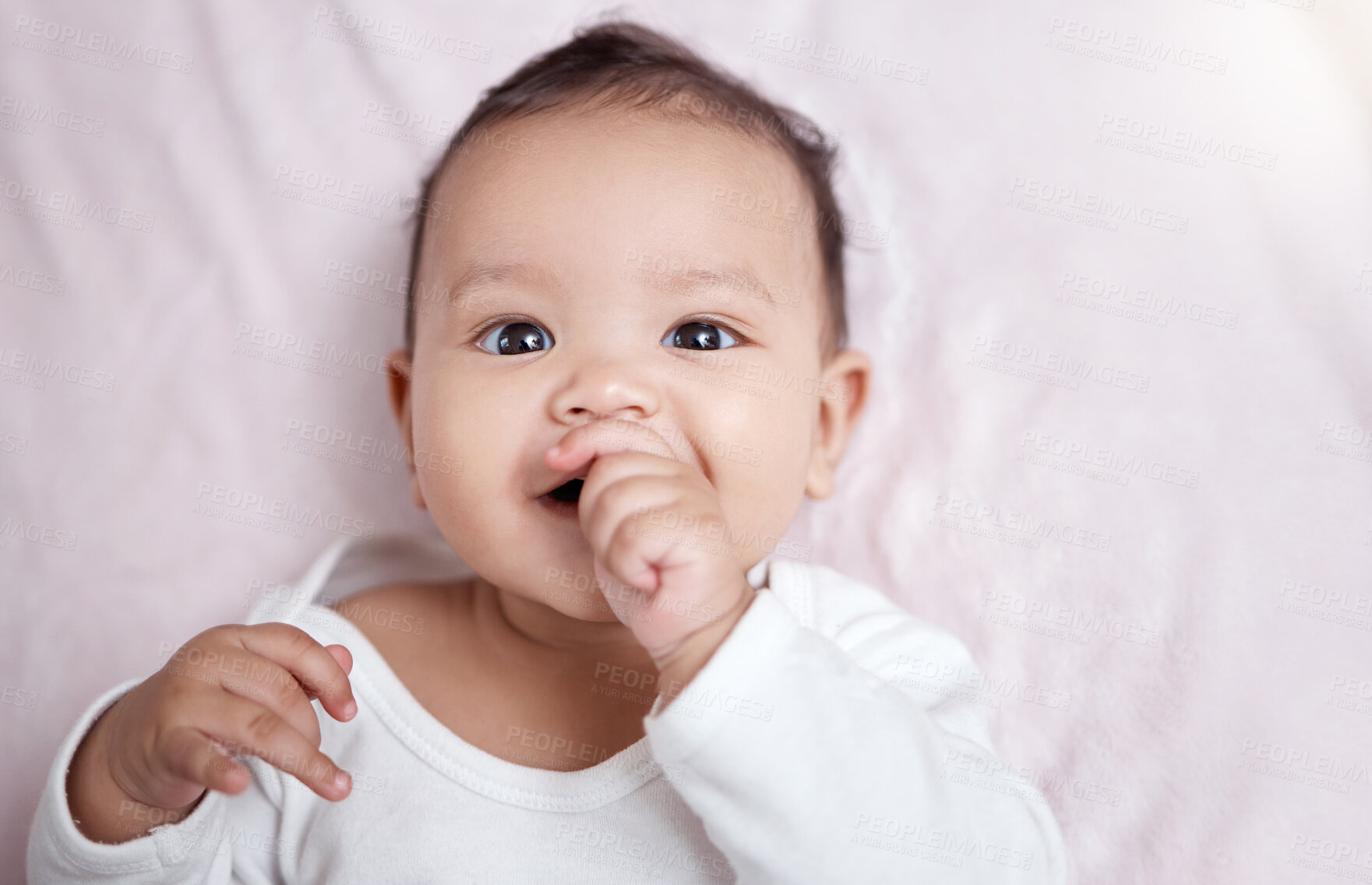 Buy stock photo Baby, portrait and thumb sucking in home, teething and child with sensory development and milestone. Above, infant and relax after nap in house, cognitive growth and chewing finger for gum relief