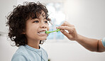 Brushing your kid's teeth properly helps prevent cavities and infection