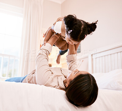 Buy stock photo Shot of a little girl playing with her mother at home