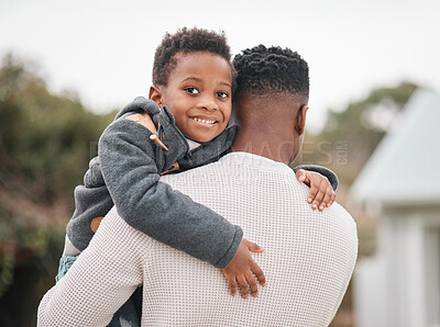 Buy stock photo Portrait of an adorable little boy being carried by his father while bonding together outdoors
