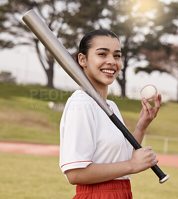 Buy stock photo Shot of an attractive young woman standing alone outside and posing with a baseball bat