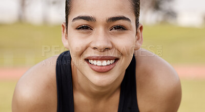 Buy stock photo Shot of an attractive young woman getting ready to play sports outside