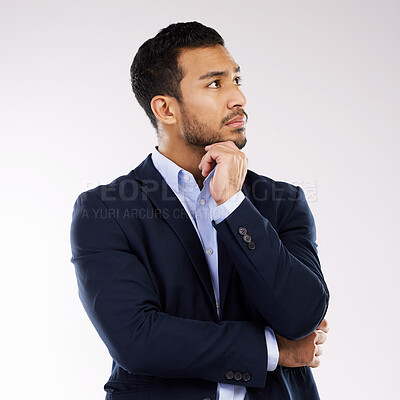 Buy stock photo Studio shot of a young businessman looking thoughtful against a white background