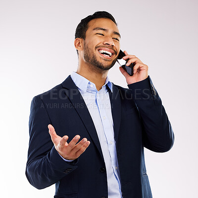 Buy stock photo Shot of a handsome man standing against a grey studio background and while using his cellphone