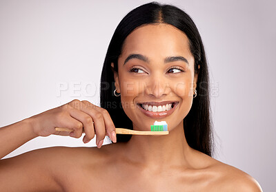 Buy stock photo Happy woman, toothbrush and teeth for dental, cleaning or hygiene against a grey studio background. Face of female person with bamboo tooth brush for clean oral, mouth and gum healthcare or wellness