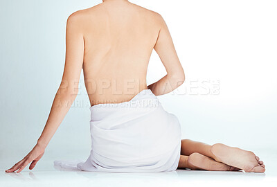 Buy stock photo Woman, back and cosmetics in naked studio, wellness and selfcare or towel on white background. Female person, nude and body care for aesthetic, skincare and treatment for health or dermatology 