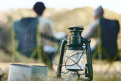 Buy stock photo Shot of a camping light and coffee mugs