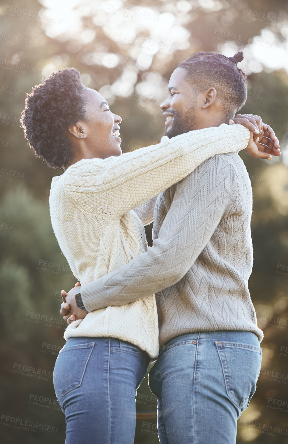 Buy stock photo Black man, woman and happy in countryside for hug, love and adventure or winter camping trip. Couple, nature and embrace outdoor for support, comfort and together for care and smile in forest or park