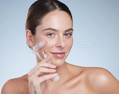 Buy stock photo Skincare portrait, woman and facial roller for wellness, blood circulation and beauty by studio background. Model girl, dermatology and crystal tool for face massage, lymphatic drainage and collagen