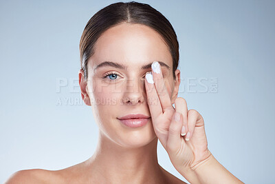 Buy stock photo Woman, face and eye cream in studio for hydration, skincare beauty on white background. Model, portrait and skin product for dermatology, wellness and results with hyaluronic acid and moisturizer 