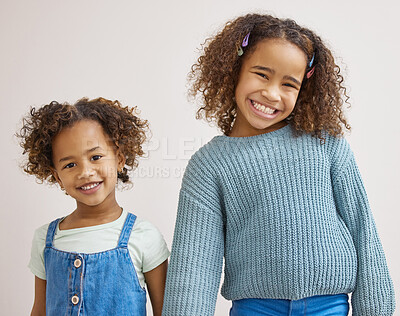 Buy stock photo Shot of two adorable little girls standing together and posing