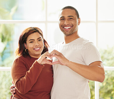 Buy stock photo Couple, portrait and hands for heart in home, hug and support for love emoji or symbol and together. People, embrace and romance sign for marriage, security and happiness in relationship for trust