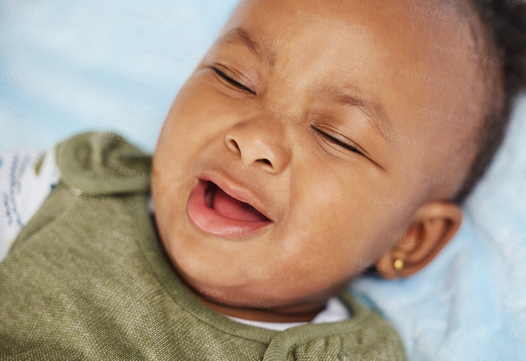 Buy stock photo Black baby, crying and sad kid or girl in home, hungry and exhausted infant or grumpy in bedroom. Female person, child and upset for development on bed, emotional and tired tears or face for fatigue