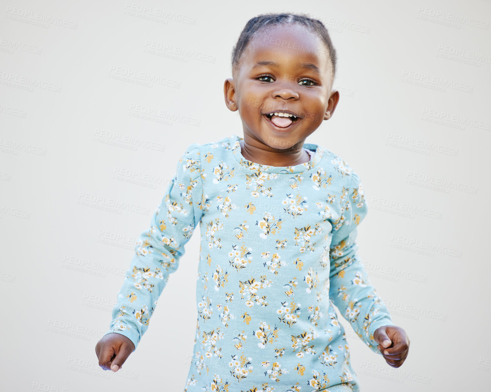 Buy stock photo Shot of an adorable little girl standing against a white background