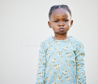 Buy stock photo Shot of an adorable little girl standing against a white background