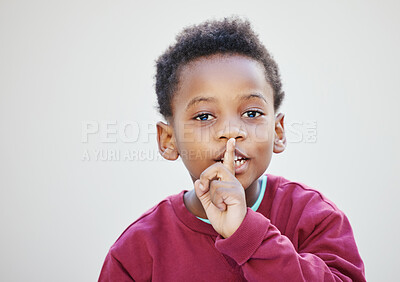 Buy stock photo Shot of an adorable little boy standing against a white background