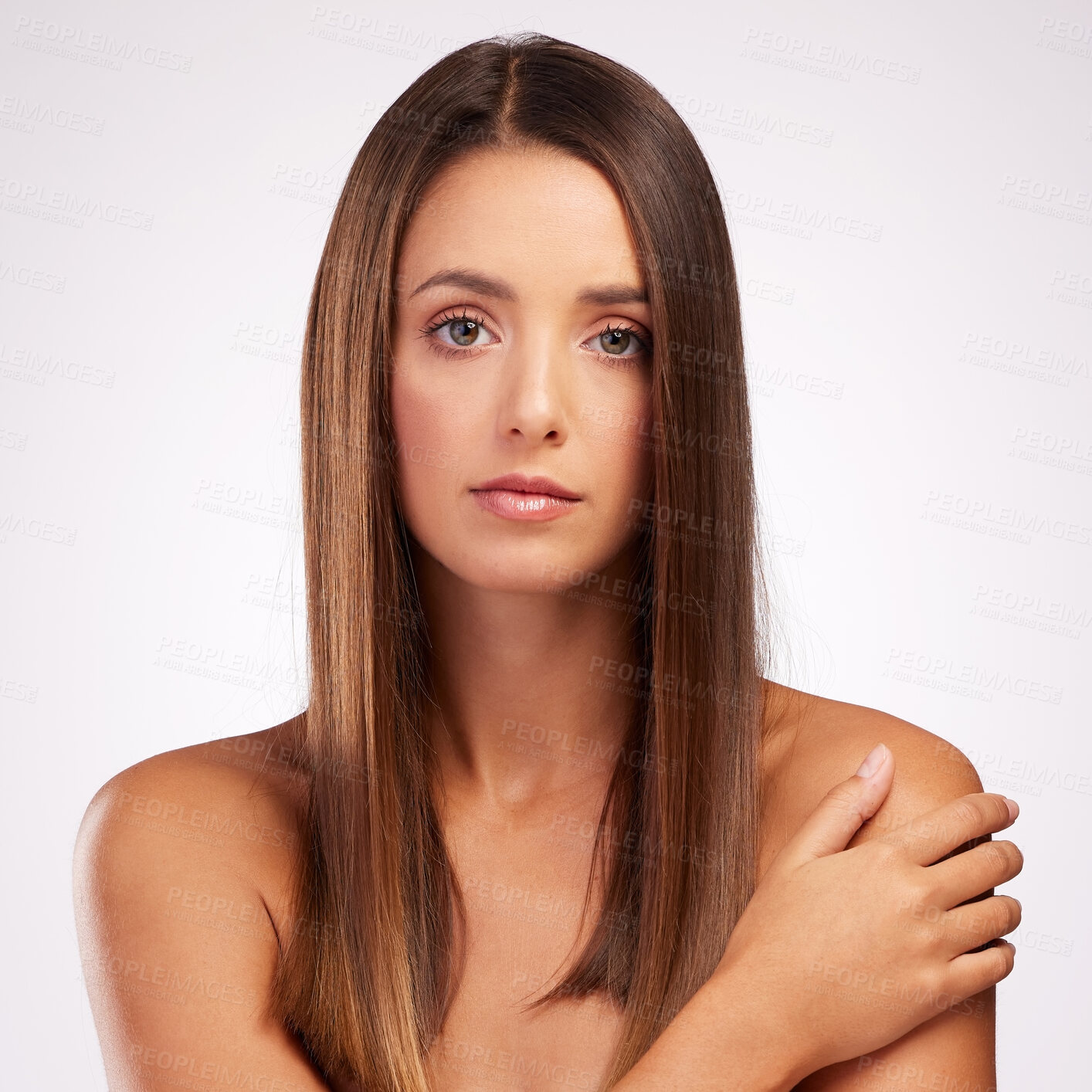 Buy stock photo Studio portrait of an attractive young woman posing against a grey background