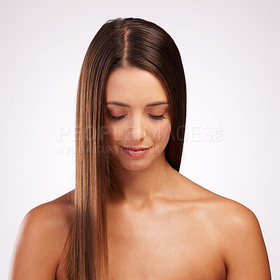 Buy stock photo Studio shot of an attractive young woman posing against a grey background