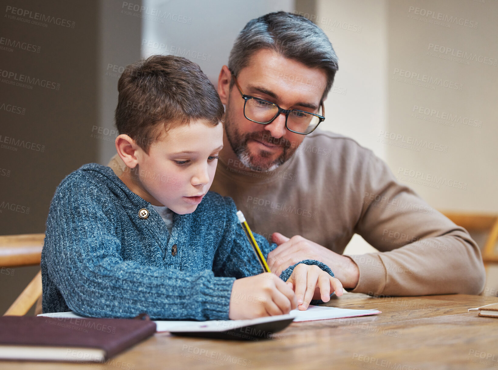 Buy stock photo Help, homework and dad with child at table for teaching, learning and notebook for school project. Writing, notes and father studying in home with man for support, advice and growth in kids education