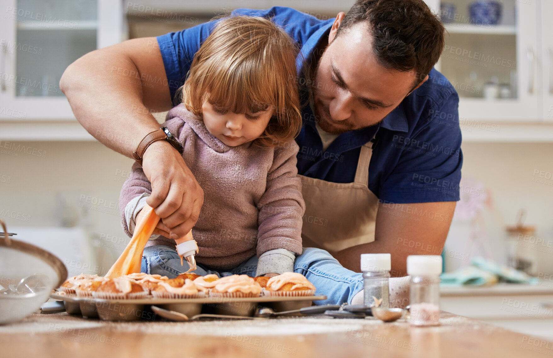 Buy stock photo Cupcakes, baking and dad with child in kitchen with frosting for bonding, learning and fun together. Family, home and happy father and girl helping with decoration for cake, dessert and sweet treats