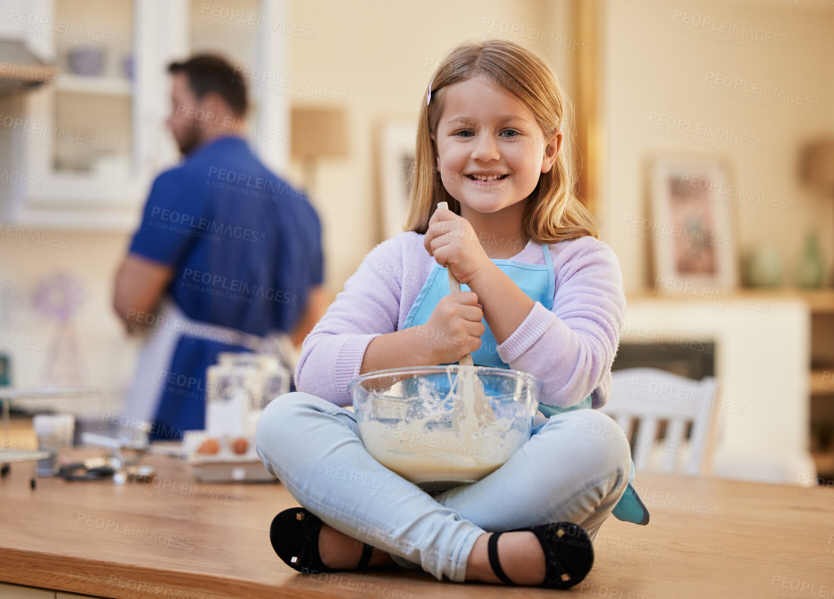Buy stock photo Shot of a little girl stirring a bowl of batter
