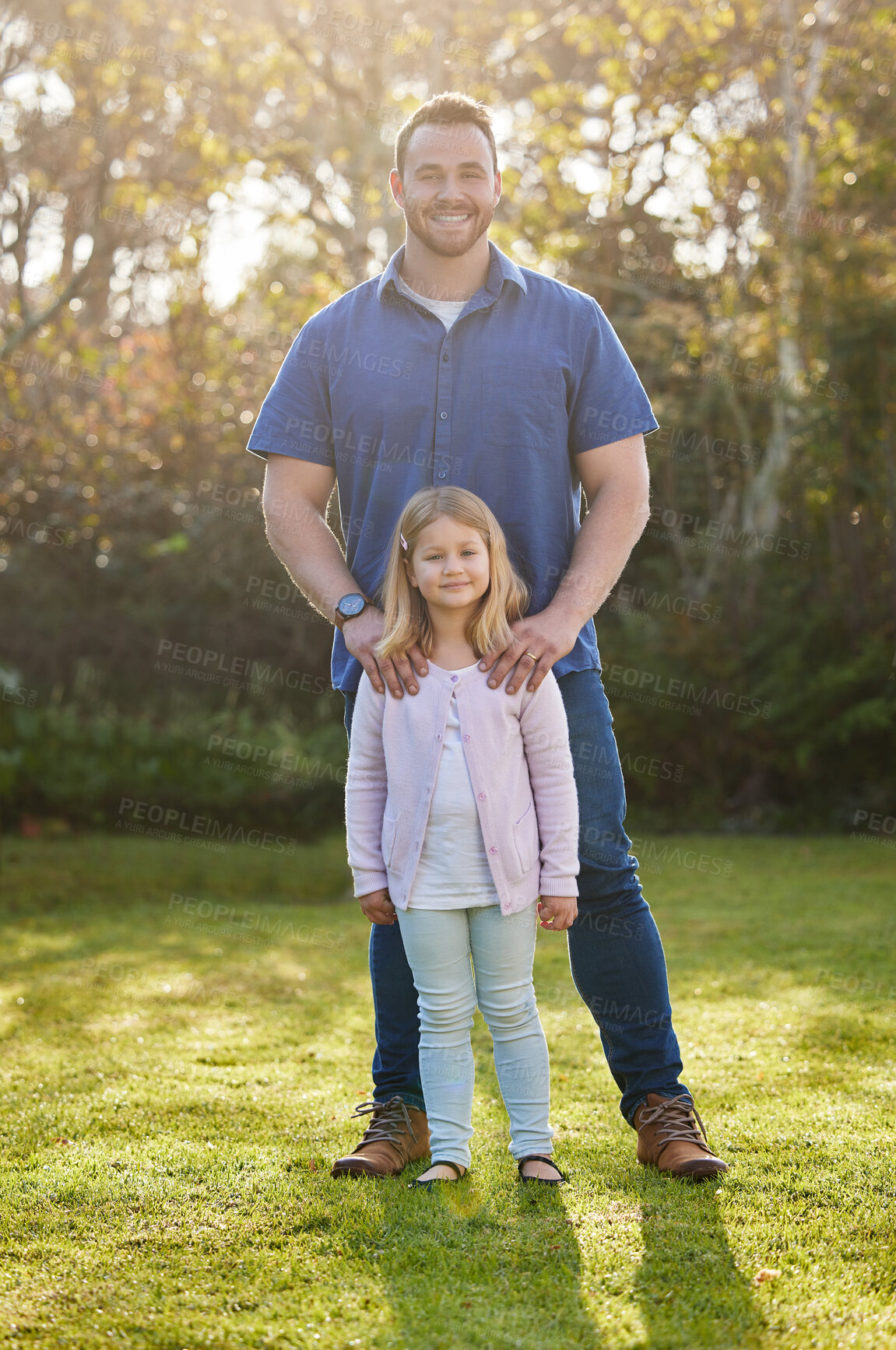 Buy stock photo Full length portrait of a handsome young man and his daughter posing outside in the garden at home