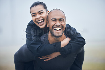 Buy stock photo Shot of a young male athlete giving his girlfriend a piggyback ride