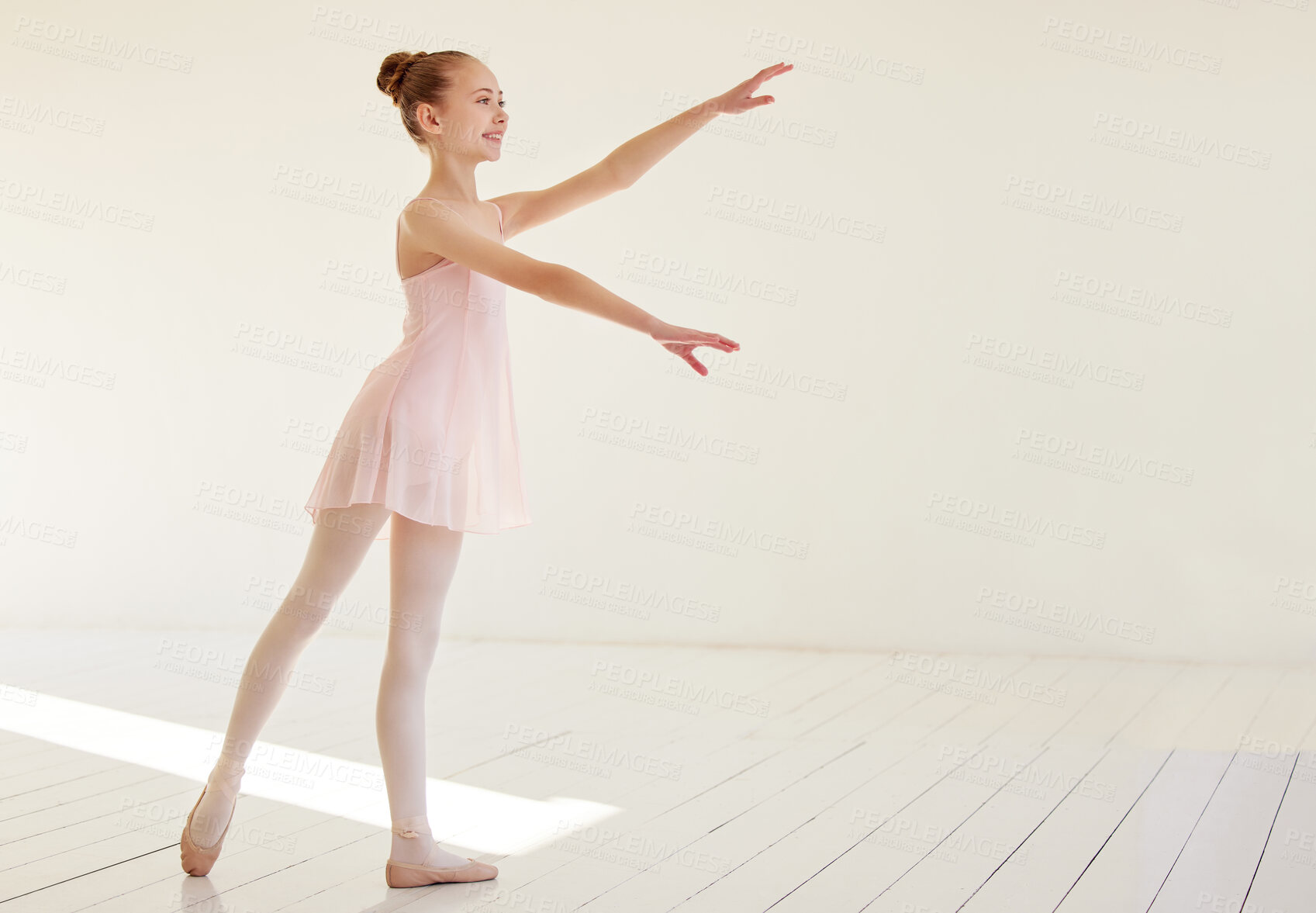 Buy stock photo Shot of a young ballerina dancing in a studio
