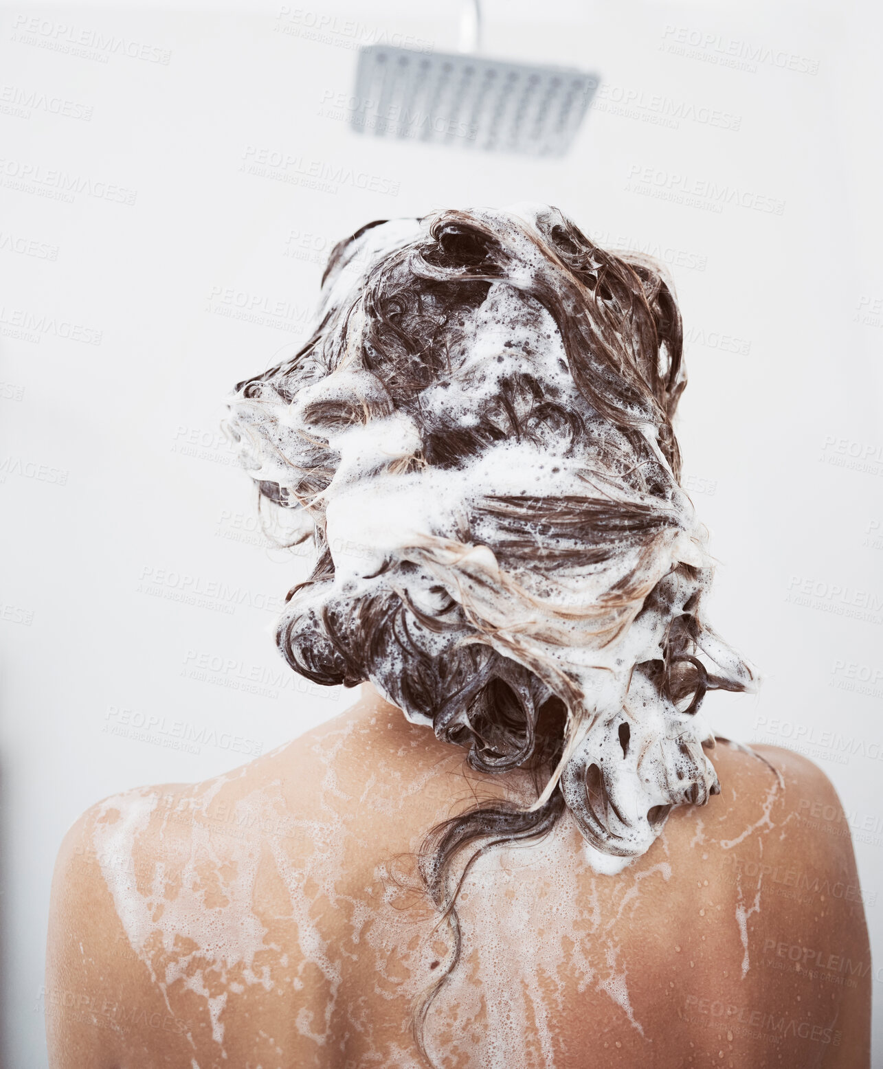 Buy stock photo Shower, washing hair and woman in bathroom with foam for shampoo, natural treatment or organic cosmetics. Back view, body and female person with soap for hygiene, cleaning or morning routine in home