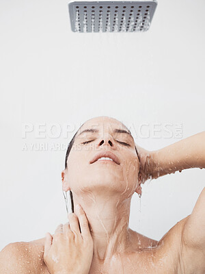 Buy stock photo Shot of a beautiful young woman taking a shower at home