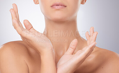 Buy stock photo Shot of an unrecognizable woman posing against a grey background
