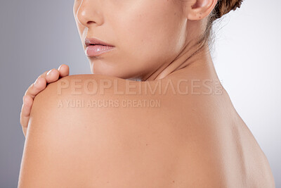 Buy stock photo Shot of an unrecognizable woman posing against a grey background