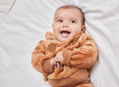 Buy stock photo Playful, happy baby and comfort in nursery for growth, development and family home as toddler, youth or child. Kid, infant and smile on bed for motor skills, love or wellness with health or nurture