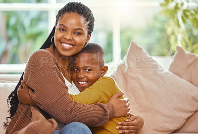 Buy stock photo Shot of a young mother hugging her son affectionately