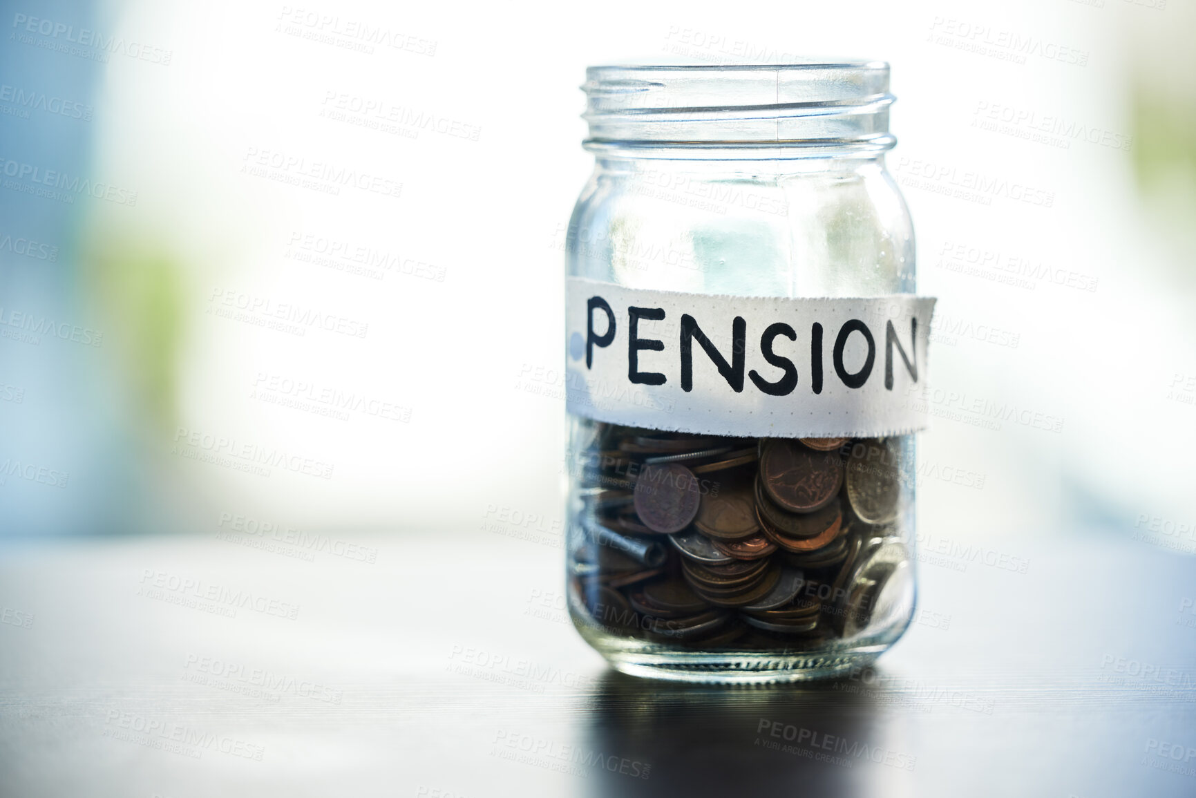 Buy stock photo Shot of a pension money jar on a table at home